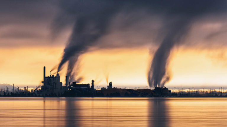 Photo of a factory polluting