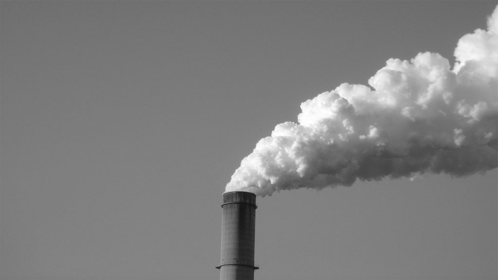 Photograph of smoke stacks in black and white