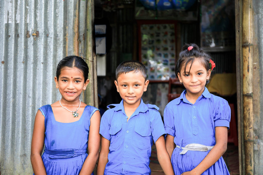 School girls outside their tin plate school in Bangladesh