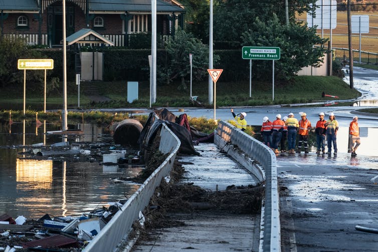 A walkway and intersection destroyed by floodwaters.