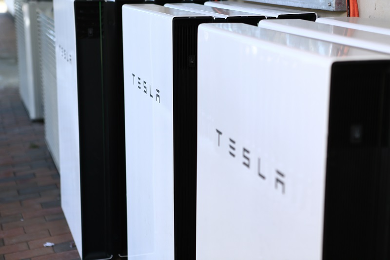 An array of Tesla Powerwall-2 batteries installed at a now battery-powered Dominos