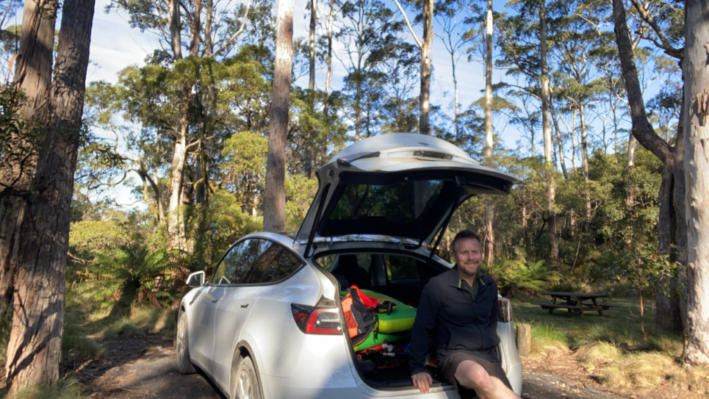 Simon Bradshaw in back of his rented EV